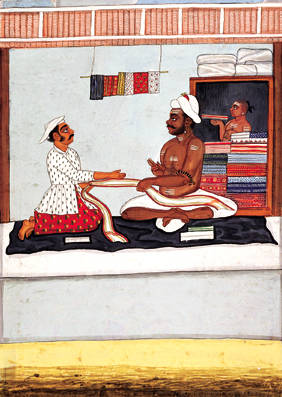 A cloth merchant, seated in his shop, selling chintz to a customer, by a Tanjore artist, c.1800