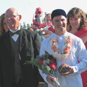 Ara Antar: Couple facing one another Sheet hung between the couple