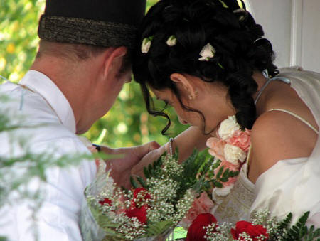 Couple light a devo together before the start of the marriage ceremony