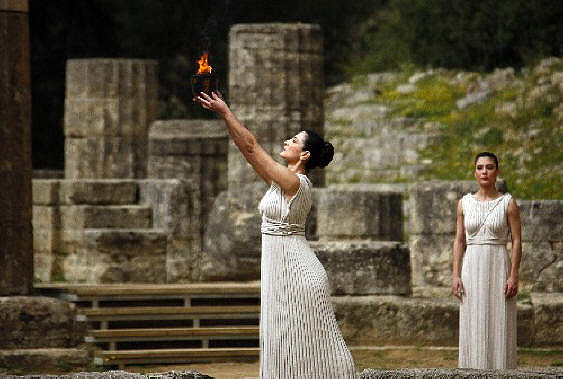 Holding up the flame