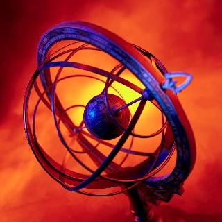 A celestial globe with a bright light in the background